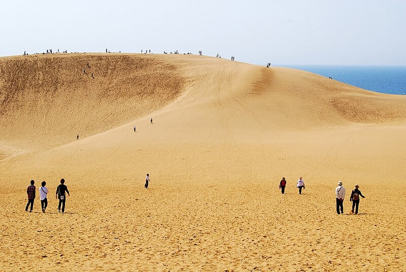 Tourists in torroti sand dunes in apan